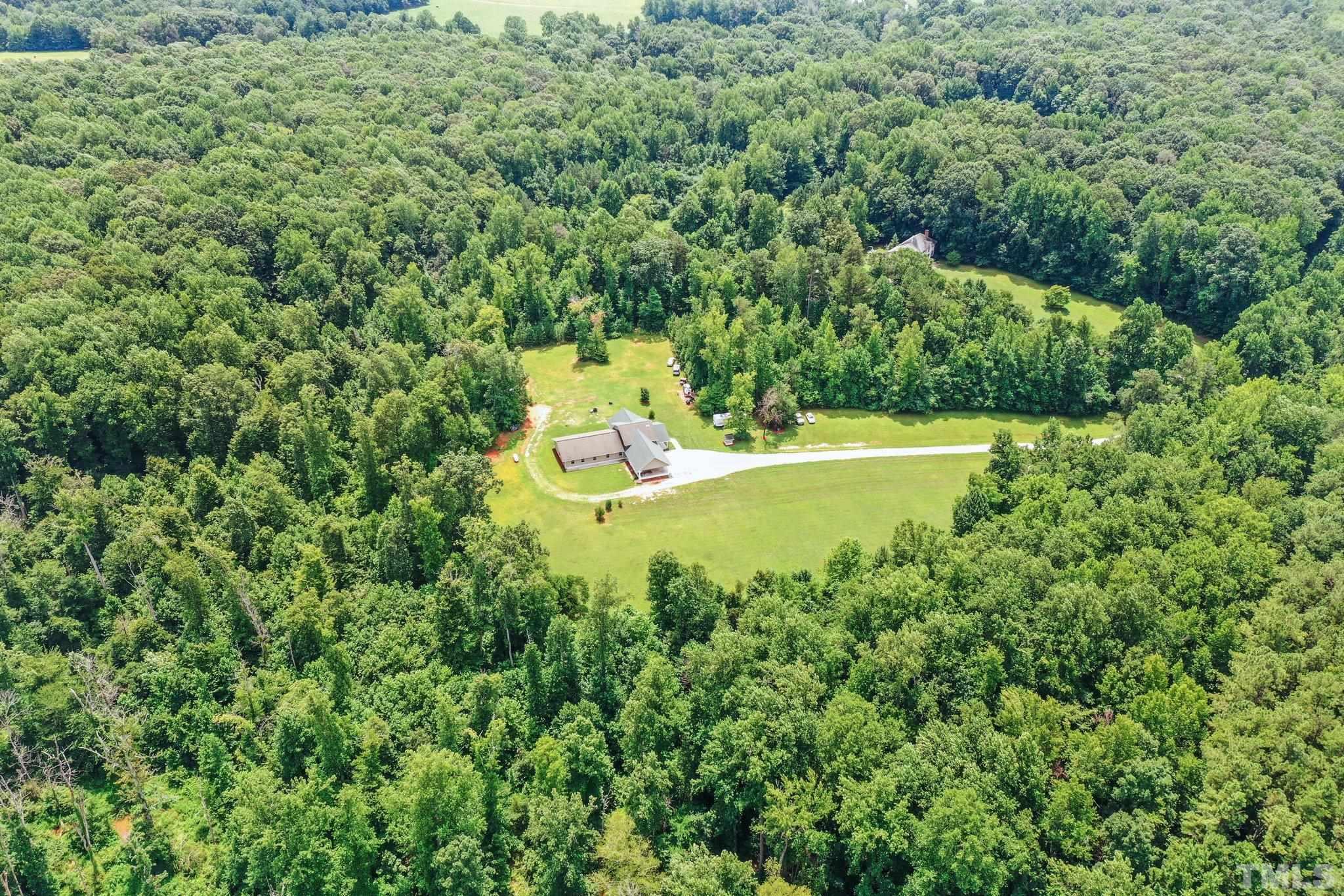 5012 Payton Drive Rougemont, NC 27572 - Photo 37 of 47 a view of a house with a backyard and swimming pool