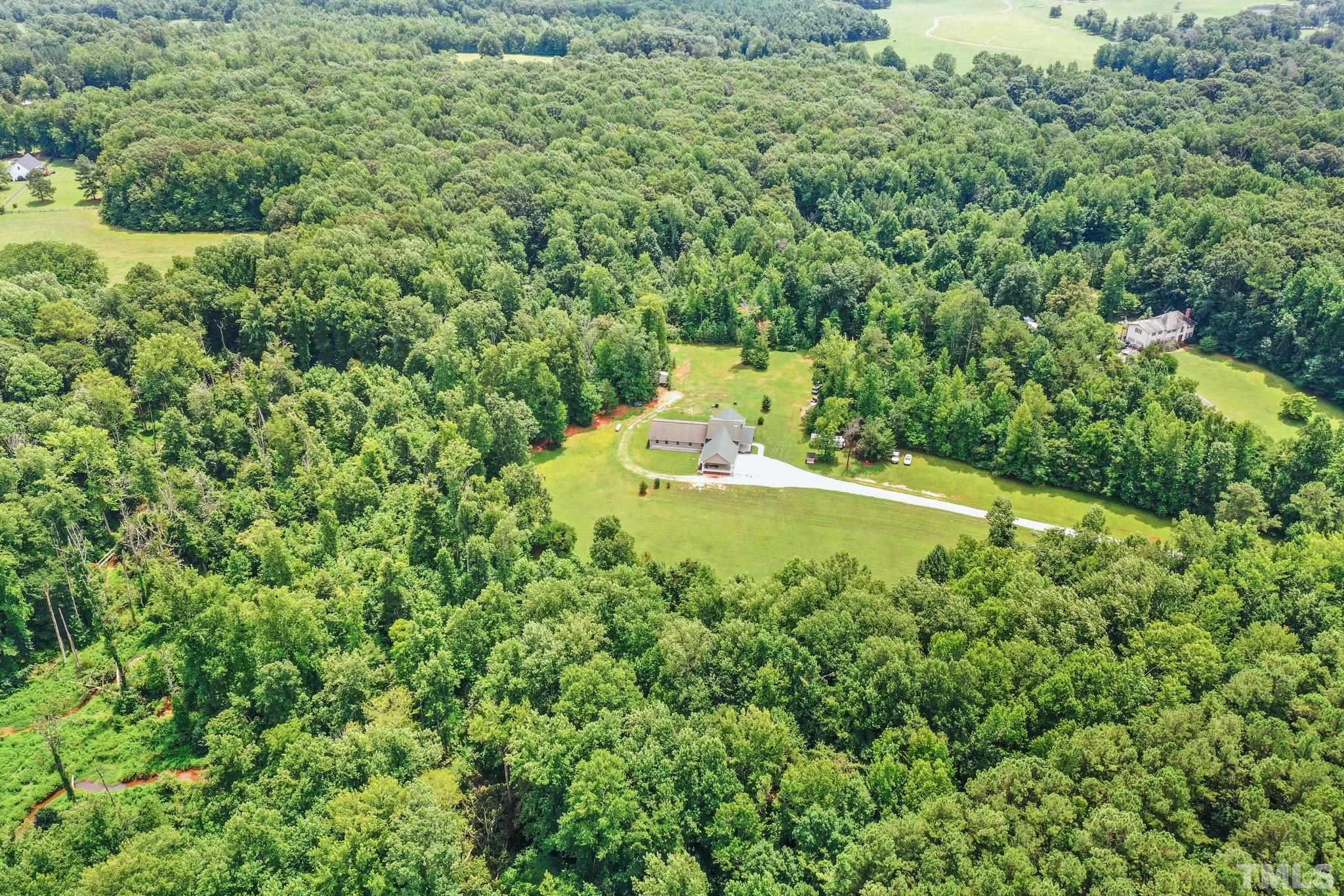 5012 Payton Drive Rougemont, NC 27572 - Photo 44 of 47 a view of a garden with a fountain