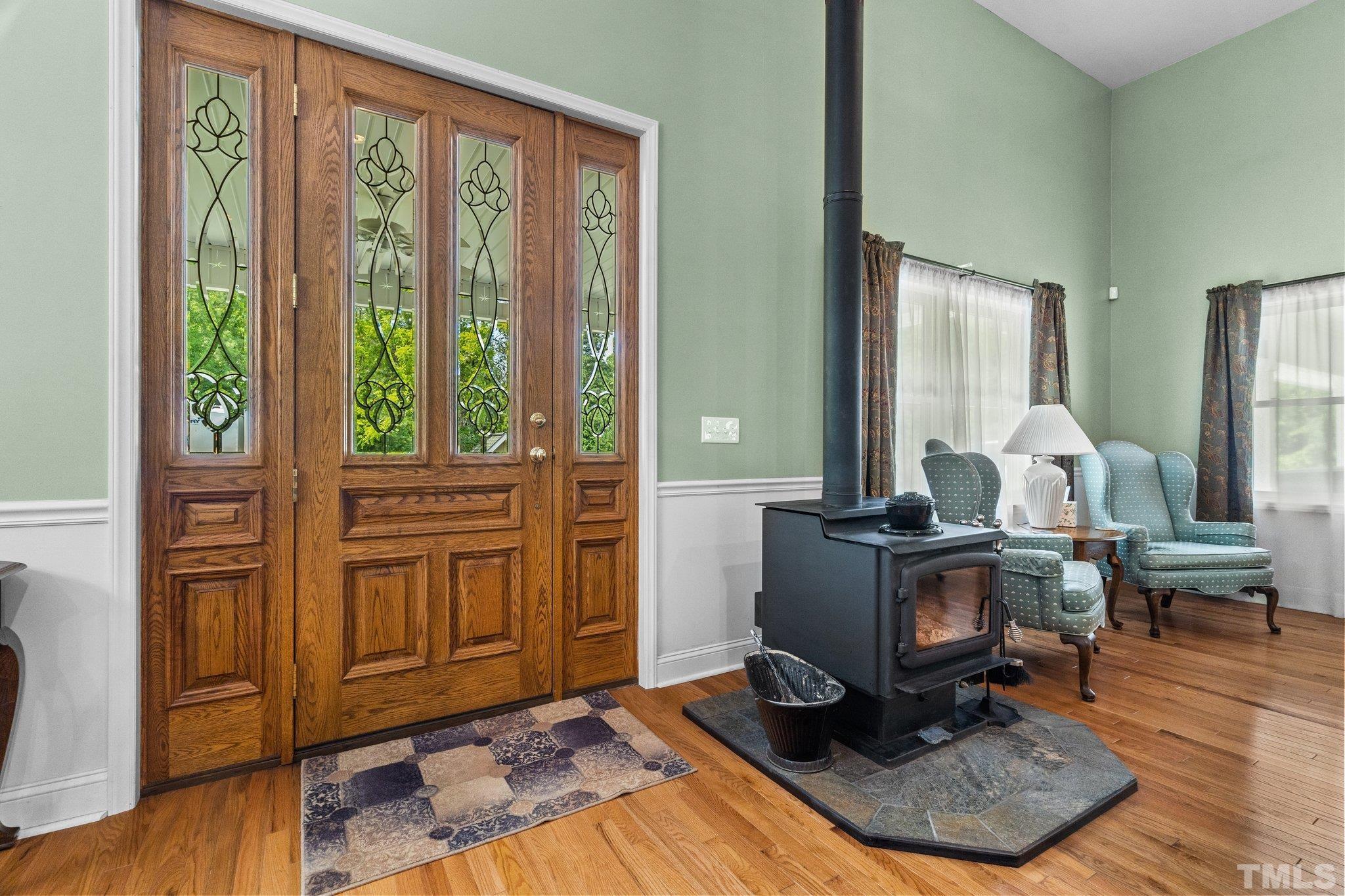5012 Payton Drive Rougemont, NC 27572 - Photo 6 of 47 a living room with furniture a wooden floor and a large window