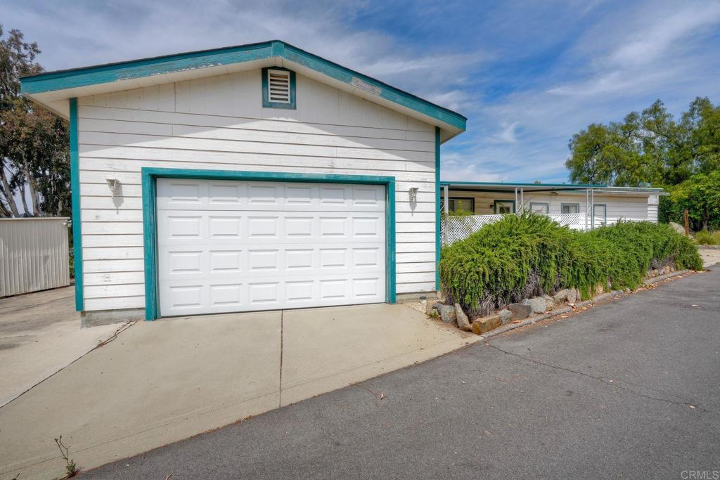 a small white house with a outdoor space
