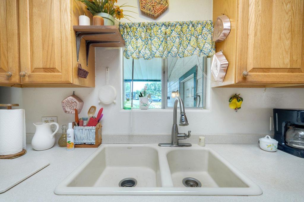 18218 Paradise Mountain Road Valley Center, CA 92082 - Photo 12 of 36 a bathroom with a sink and a window
