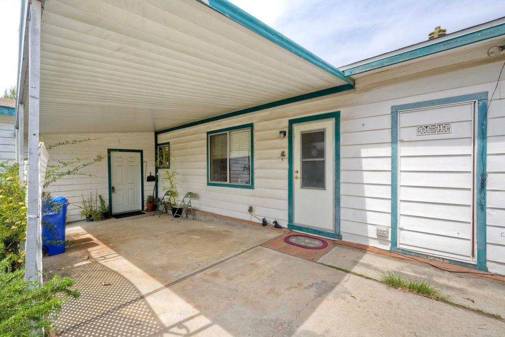 18218 Paradise Mountain Road Valley Center, CA 92082 - Photo 2 of 36 a front view of a house with a garage