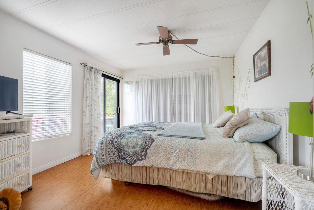 18218 Paradise Mountain Road Valley Center, CA 92082 - Photo 27 of 36 a bedroom with a bed and window