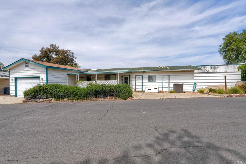 18218 Paradise Mountain Road Valley Center, CA 92082 - Photo 3 of 36 front view of house with a street