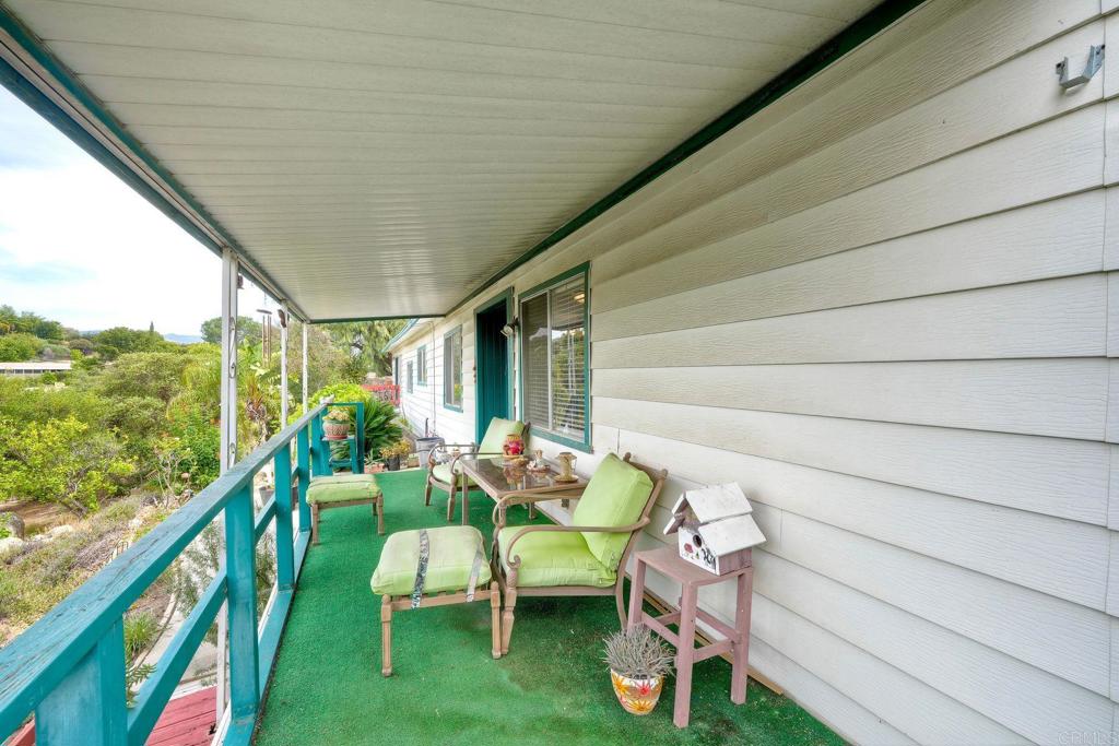 18218 Paradise Mountain Road Valley Center, CA 92082 - Photo 36 of 36 a balcony with furniture and garden view