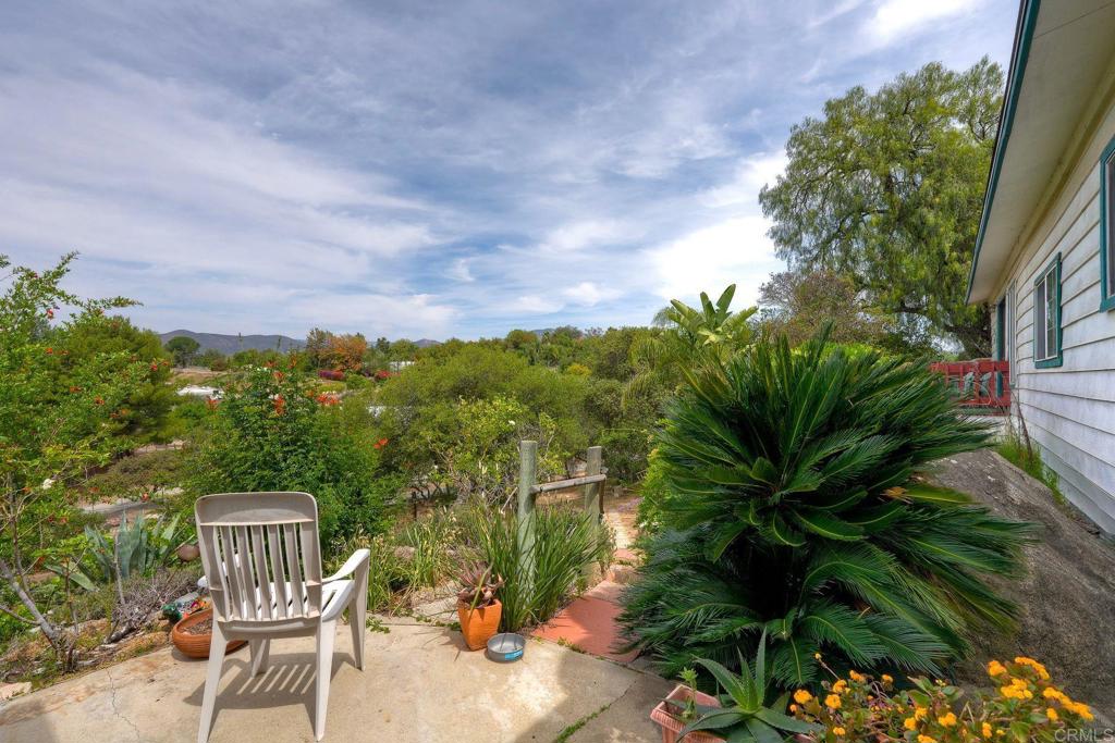 18218 Paradise Mountain Road Valley Center, CA 92082 - Photo 5 of 36 a view of a chairs and table in the patio