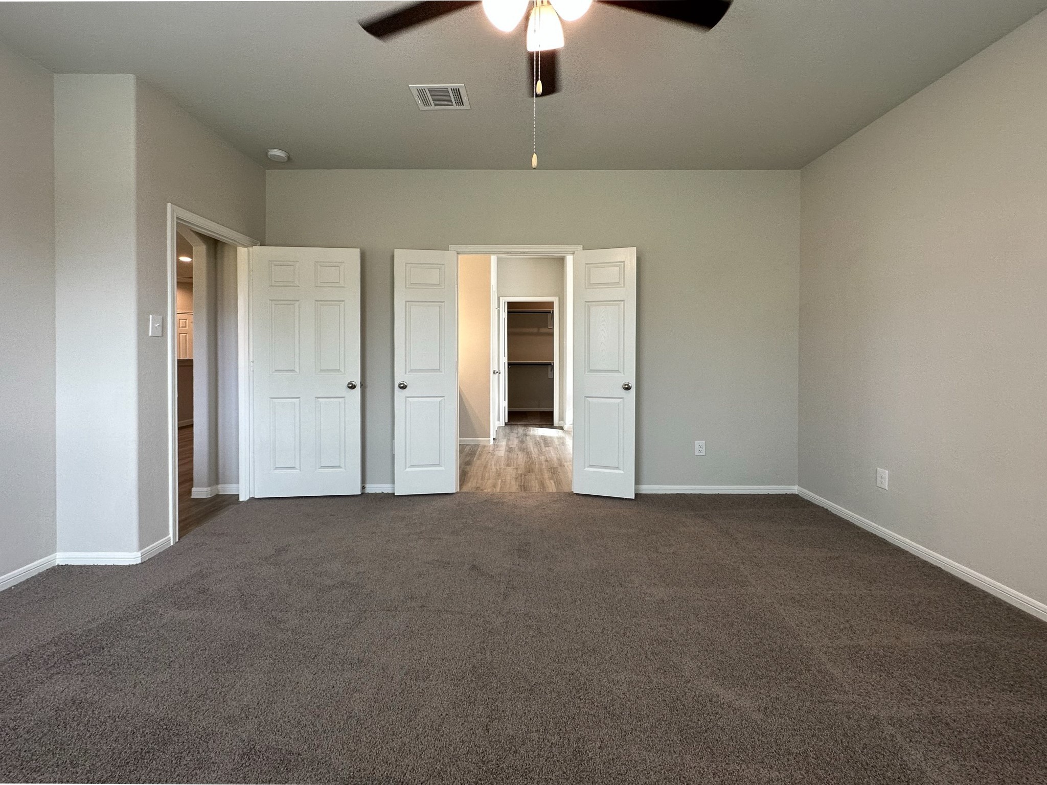 27079 Badger Way Magnolia, TX 77354 - Photo 16 of 40 an empty room with chandelier fan and windows