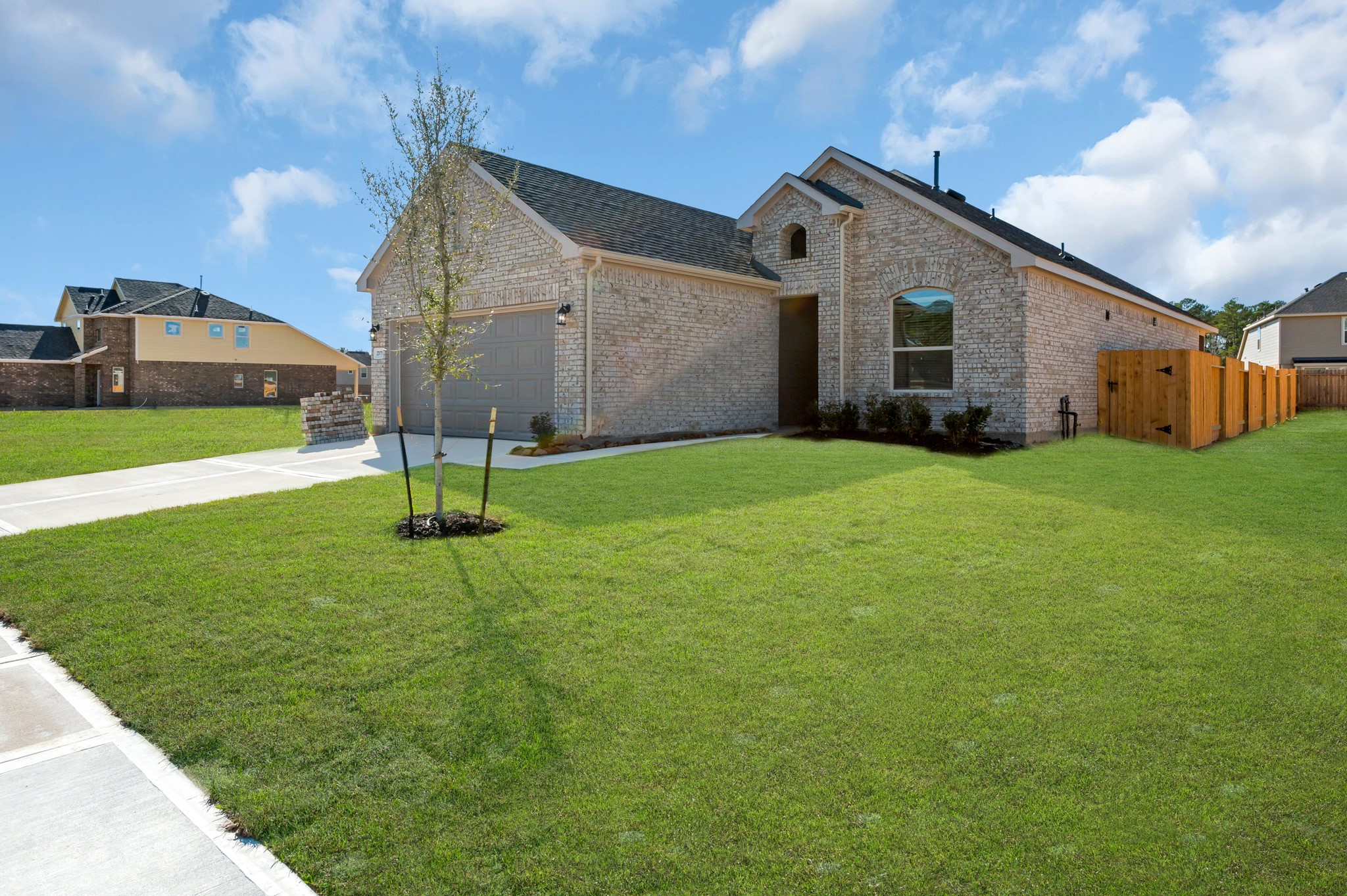 27079 Badger Way Magnolia, TX 77354 - Photo 2 of 40 a house view with a garden space