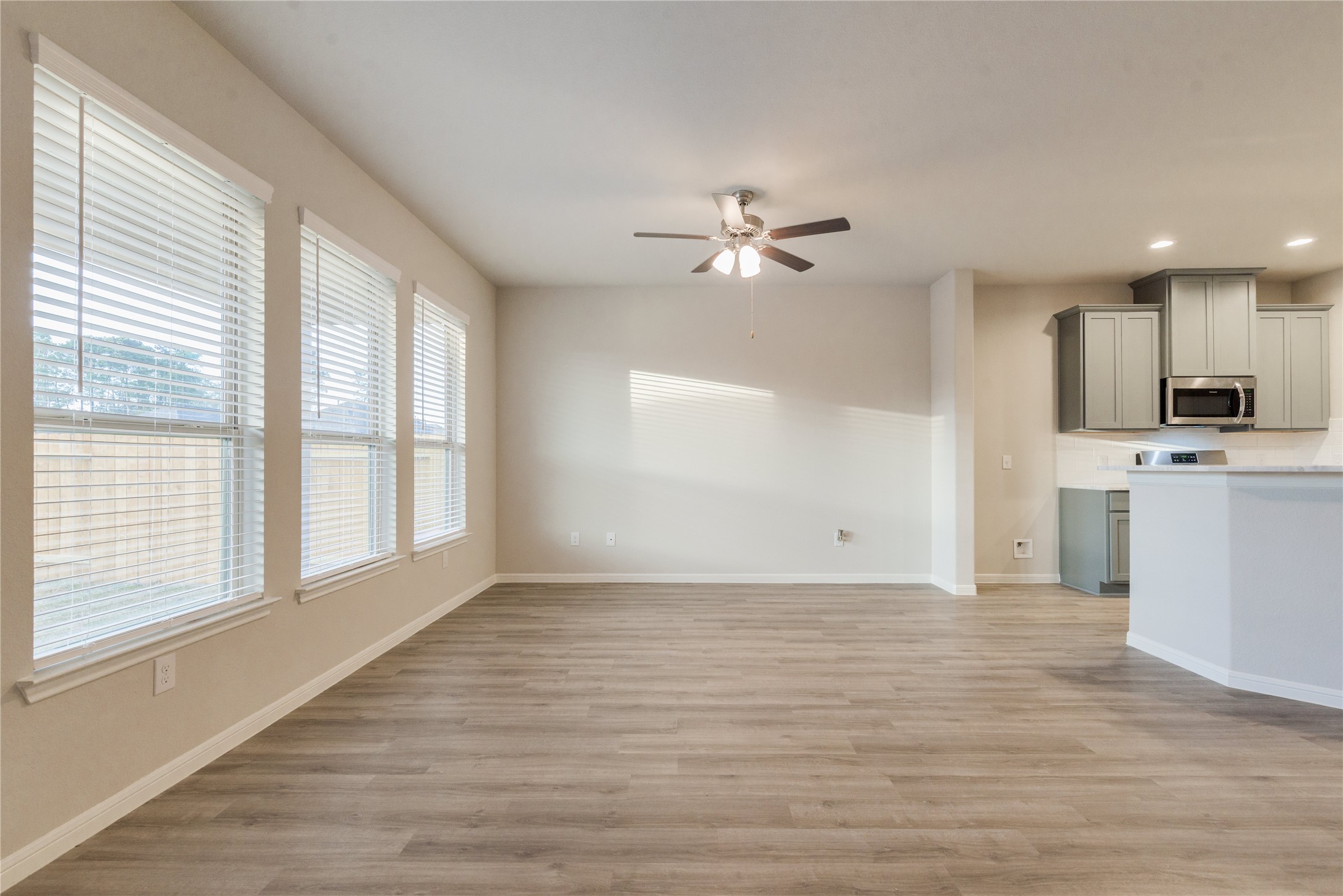 27079 Badger Way Magnolia, TX 77354 - Photo 21 of 40 a view of an empty room with a kitchen and a window