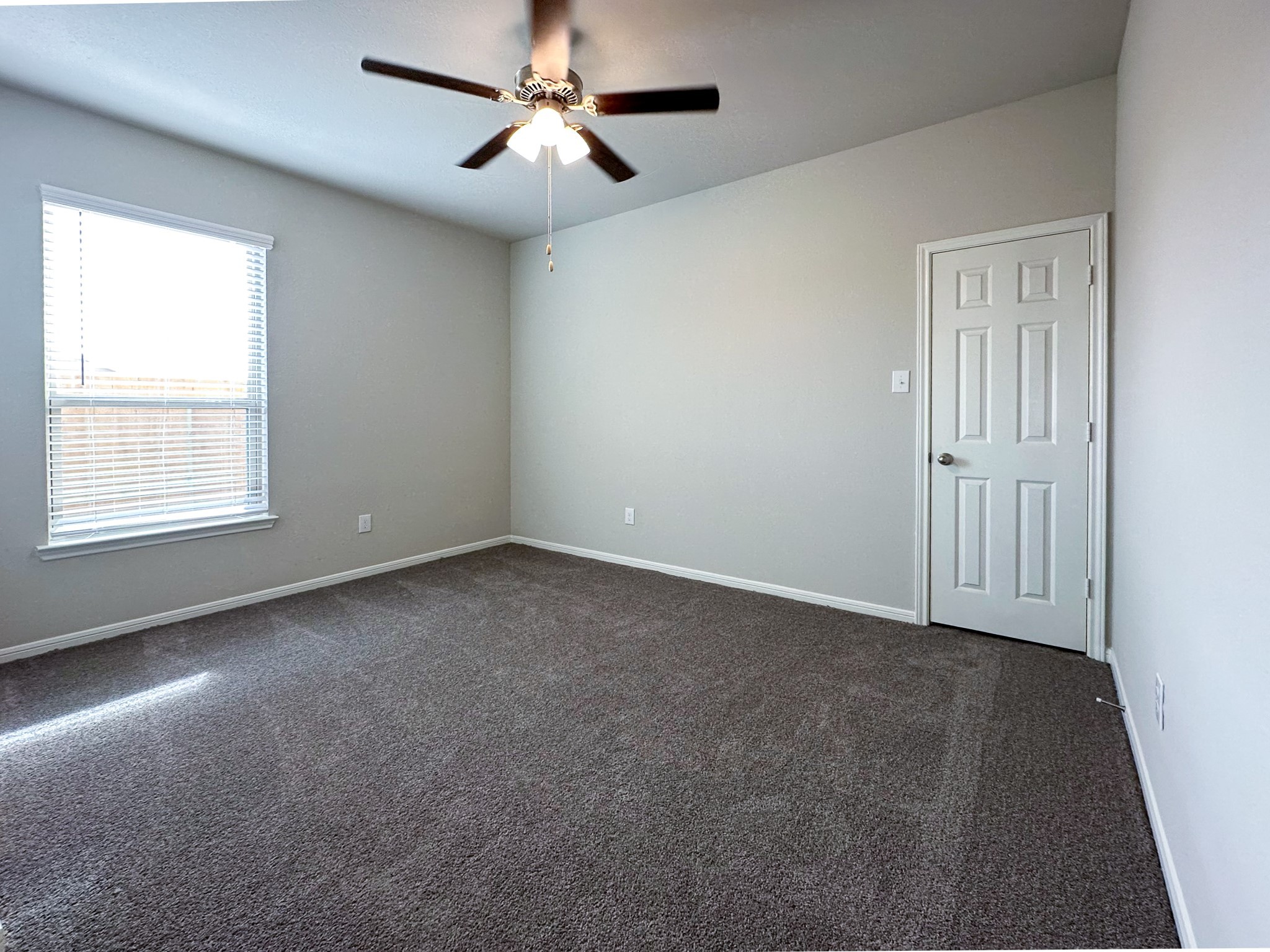 27079 Badger Way Magnolia, TX 77354 - Photo 32 of 40 an empty room with windows and fan
