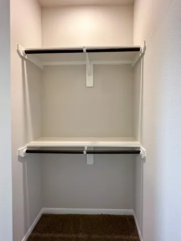 a bathroom with a double vanity sink toilet and a bathtub