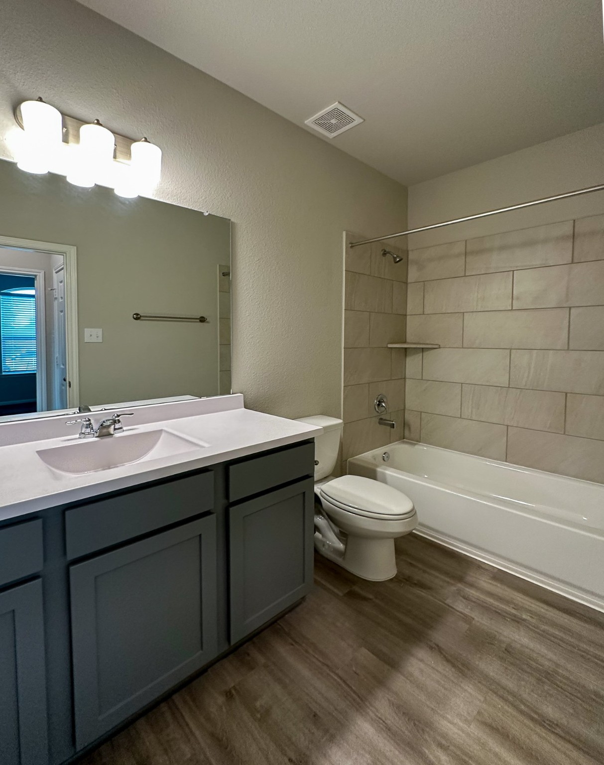 27079 Badger Way Magnolia, TX 77354 - Photo 34 of 40 a bathroom with a double vanity sink toilet and a bathtub