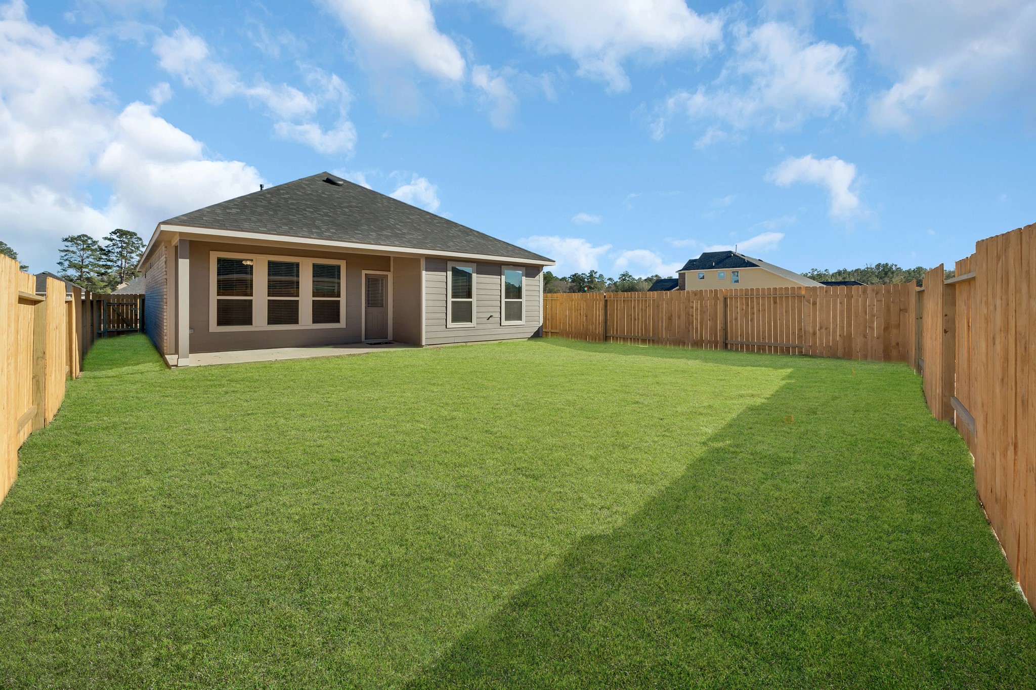 27079 Badger Way Magnolia, TX 77354 - Photo 38 of 40 a view of a yard in front of a house with large trees