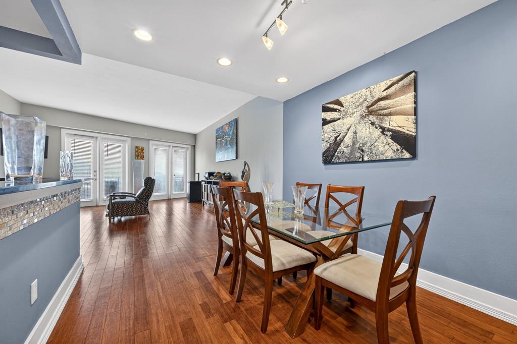 5055 Addison Circle, Unit 713 Addison, TX 75001 - Photo 13 of 40 Dining area featuring wood-finish flooring, recessed lighting, and a contemporary track light fixture