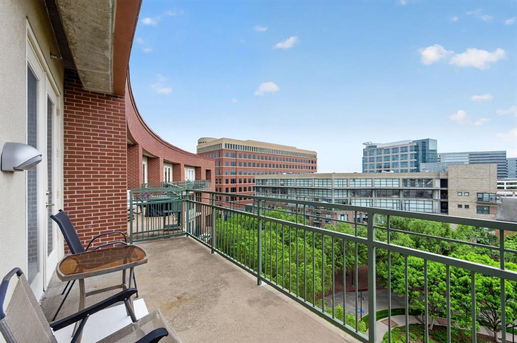 5055 Addison Circle, Unit 713 Addison, TX 75001 - Photo 27 of 40 Curved brick exterior with a private concrete balcony