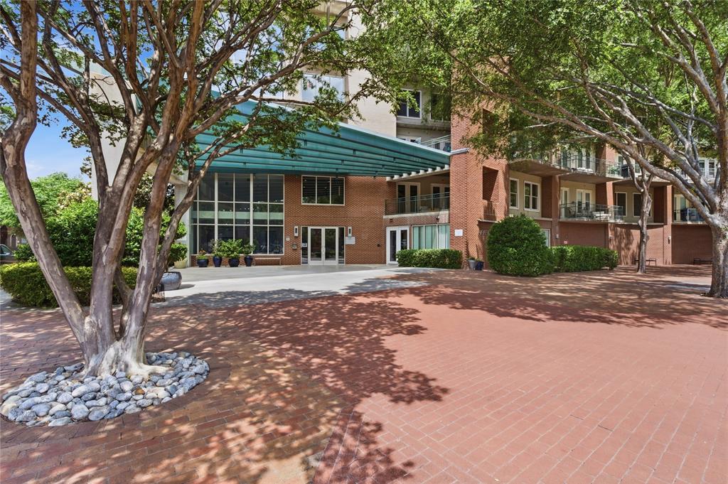 5055 Addison Circle, Unit 713 Addison, TX 75001 - Photo 31 of 40 a front view of a house with a garden