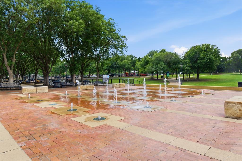 5055 Addison Circle, Unit 713 Addison, TX 75001 - Photo 37 of 40 a view of a swimming pool with a patio
