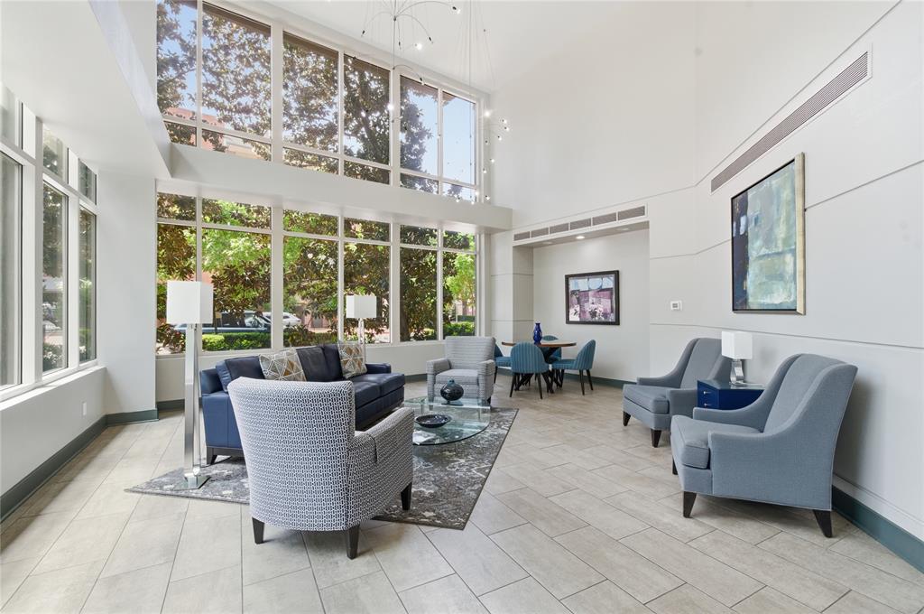 5055 Addison Circle, Unit 713 Addison, TX 75001 - Photo 40 of 40 Two-story windows and high ceilings define this expansive common area