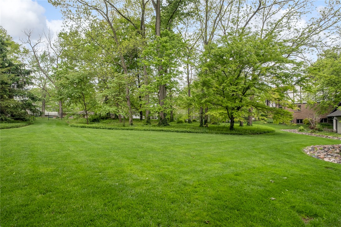 273 North Alpha Bellbrook Road Dayton, OH 45434 - Photo 39 of 43 Expansive green yard with mature trees, perfect for outdoor living and recreation.