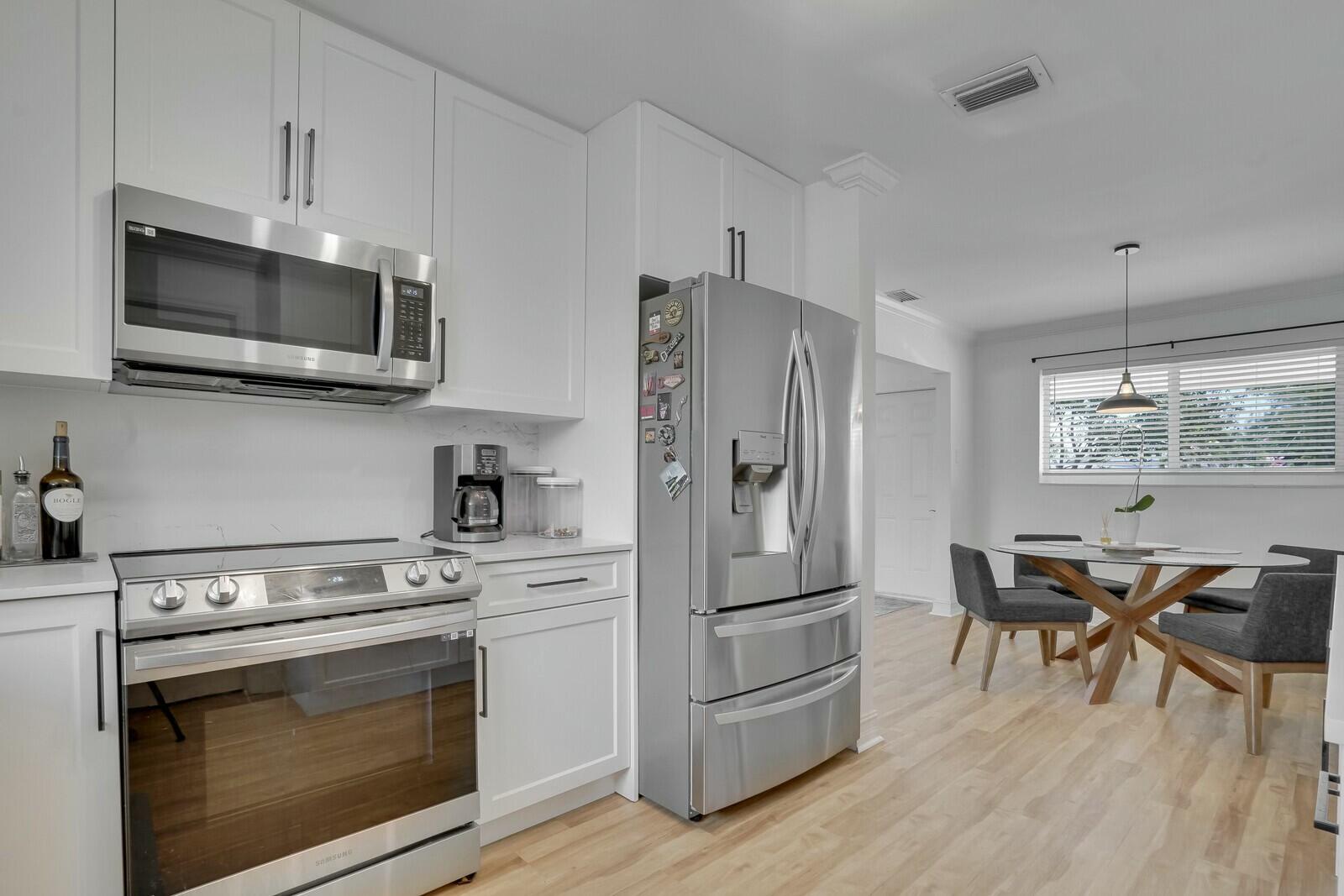 455 Northeast 34th Street Boca Raton, FL 33431 - Photo 16 of 27 Sleek Kitchen with Ample Storage