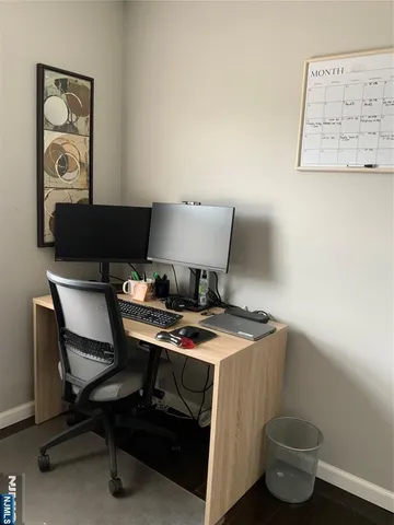 a view of a workspace with furniture