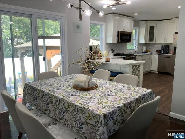 a kitchen with a table and chairs in it