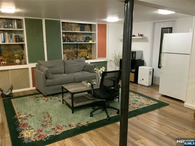 a living room with furniture and a rug