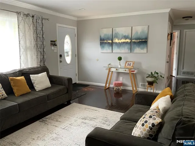 a living room with furniture and a table