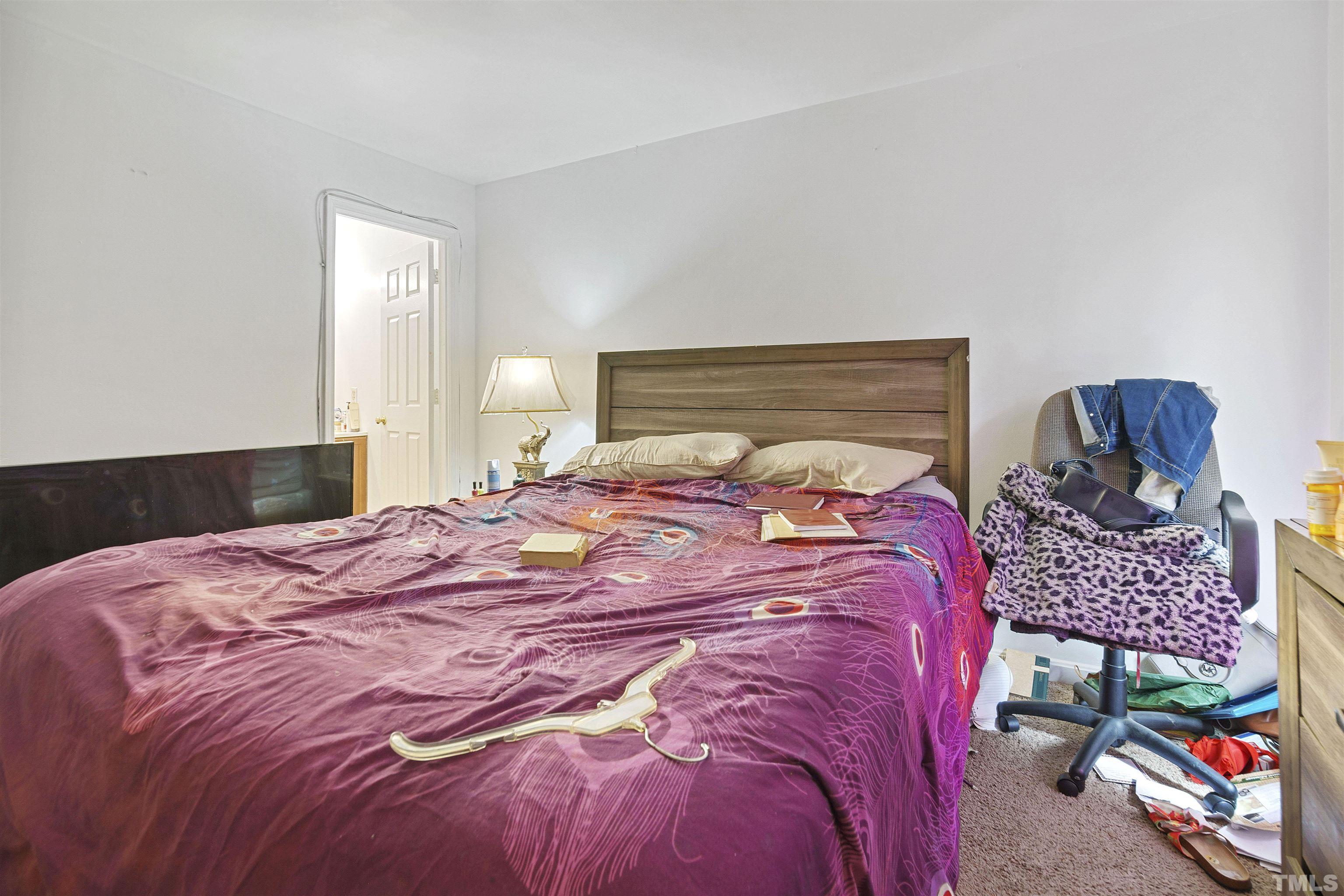 1505 Wiljohn Road Garner, NC 27529 - Photo 2 of 15 a bedroom with a bed and a window