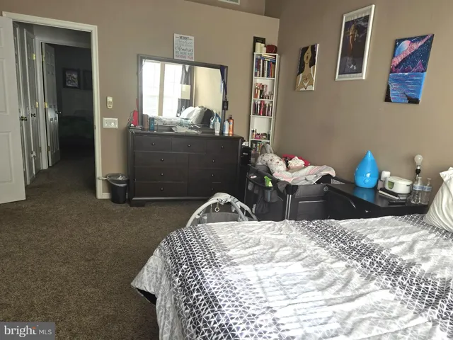 a bedroom with a bed and furniture