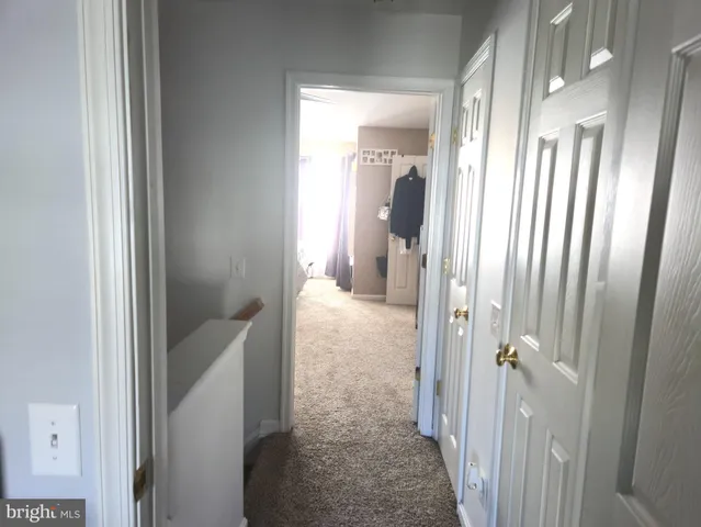 a view of a bathroom from a hallway