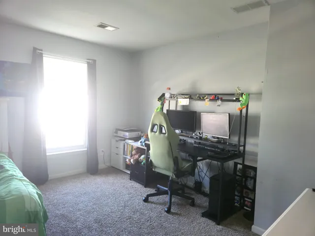 a workspace with furniture and window