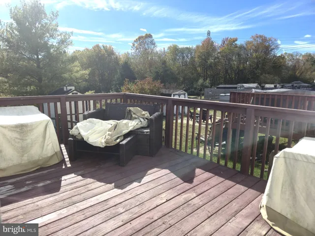 a view of a balcony with wooden floor