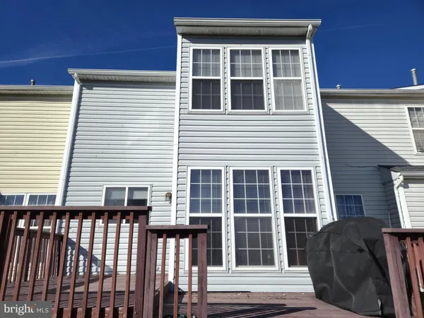 a front view of a house with a glass door