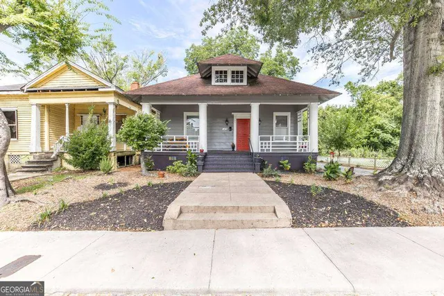 a front view of a house with yard