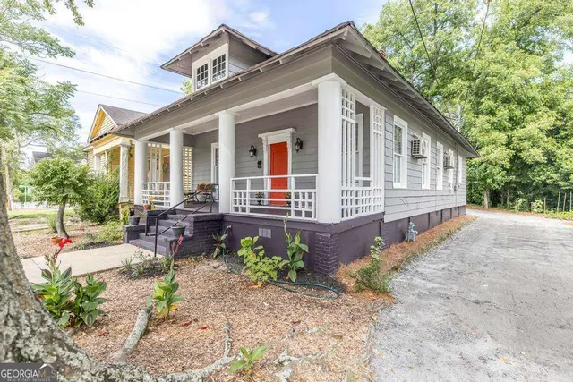 a front view of a house with garden
