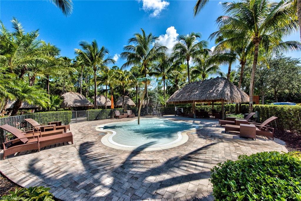 9102 Capistrano Street South, Unit 7209 Naples, FL 34113 - Photo 20 of 25 a view of a backyard with sitting area