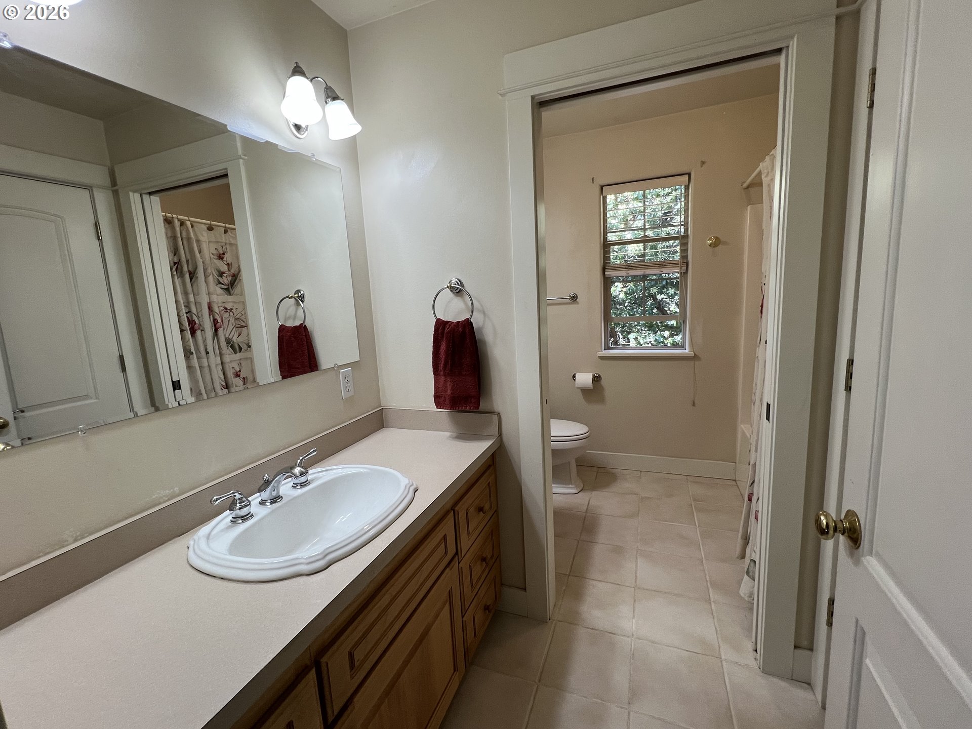 28544 Crow Road Eugene, OR 97402 - Photo 28 of 48 a bathroom with a sink a vanity and a mirror