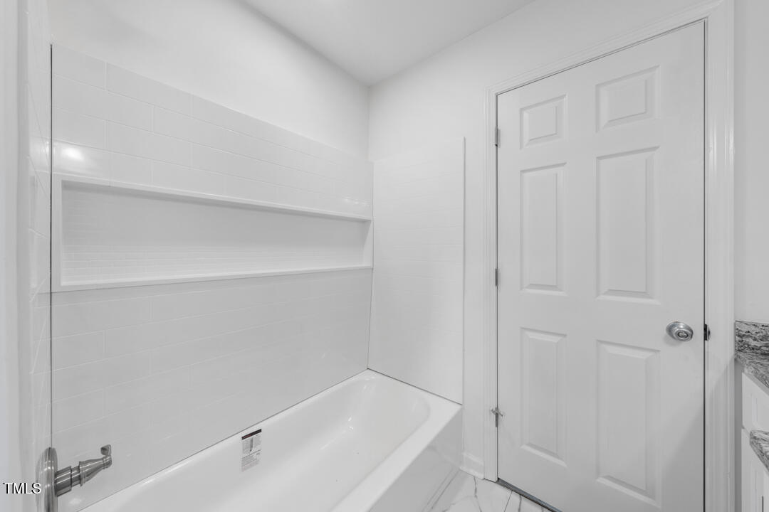 332 Gunn Poole Road Mebane, NC 27302 - Photo 16 of 27 a bathroom with a bathtub
