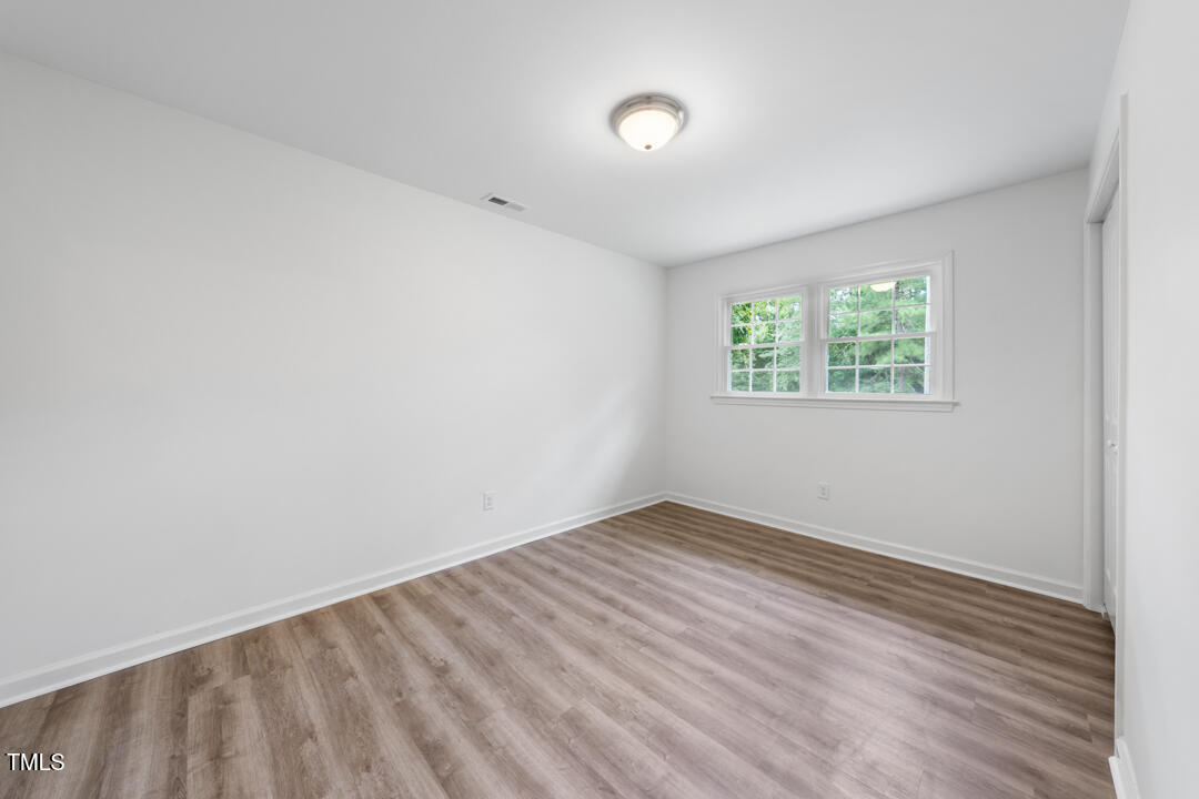 332 Gunn Poole Road Mebane, NC 27302 - Photo 18 of 27 an empty room with windows