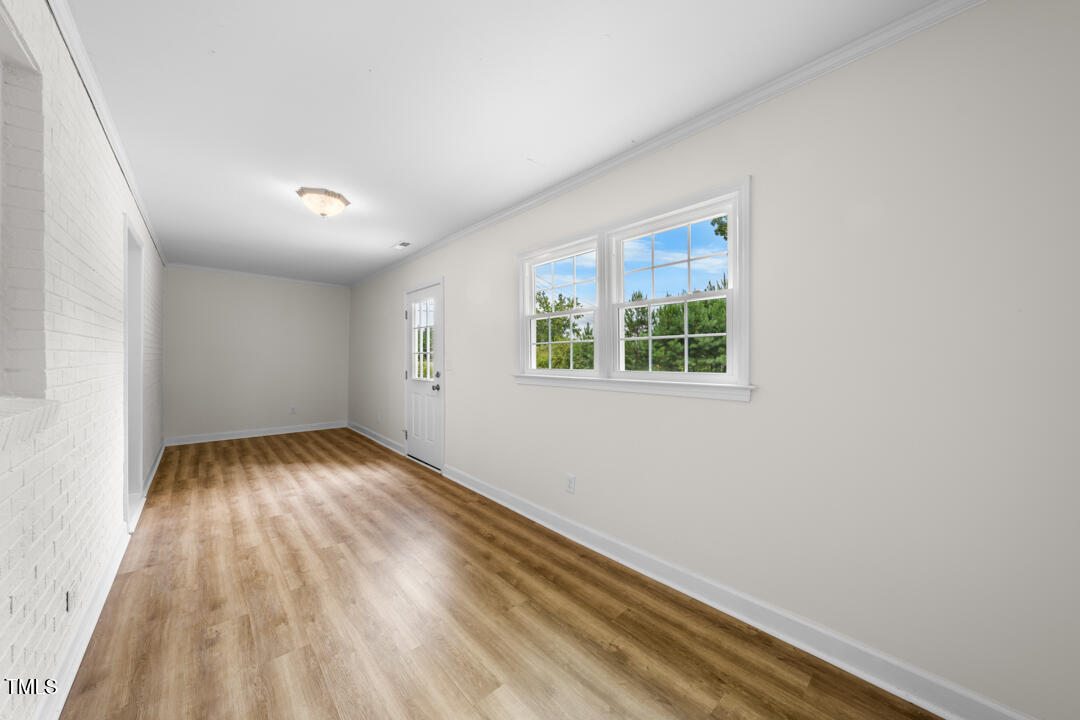 332 Gunn Poole Road Mebane, NC 27302 - Photo 20 of 27 wooden floor in an empty room with a window