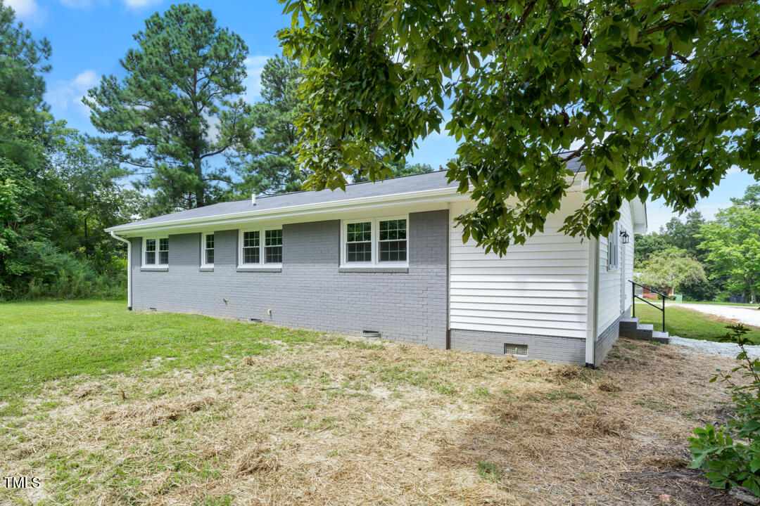 332 Gunn Poole Road Mebane, NC 27302 - Photo 21 of 27 a front view of a house with a garden