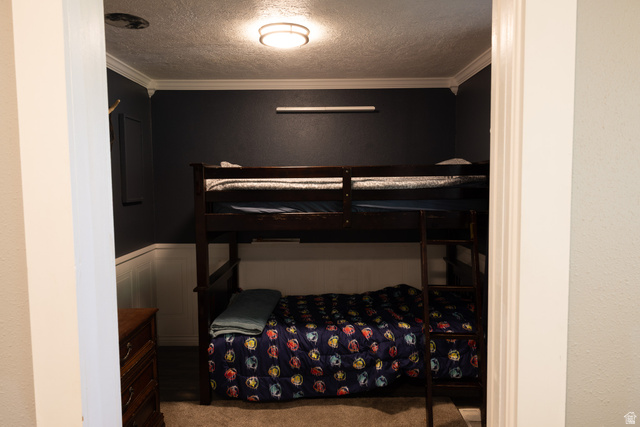 827 South 600 East Logan, UT 84321 - Photo 6 of 30 Compact room featuring dark wall paint and wainscoting