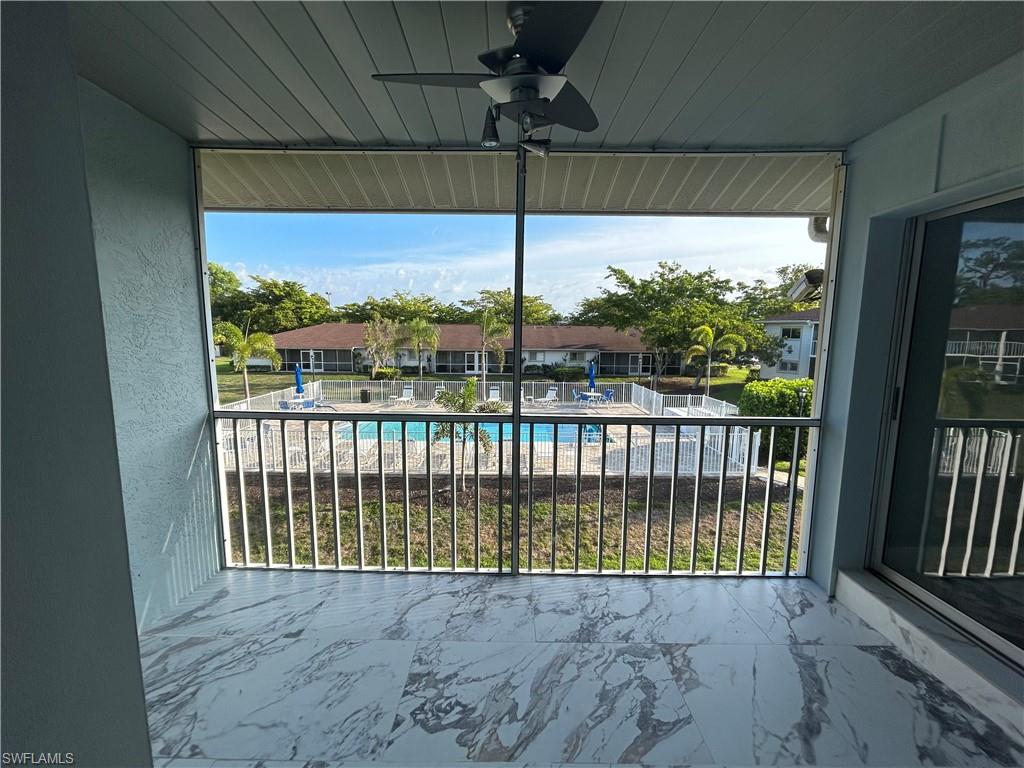 2346 Naples Trace Circle, Unit 1107 Naples, FL 34109 - Photo 17 of 17 View of the community pool from the balcony