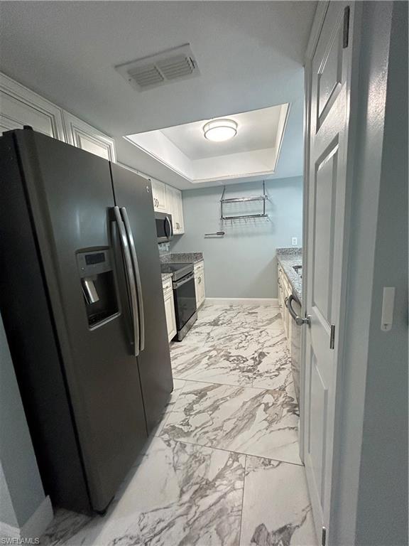 2346 Naples Trace Circle, Unit 1107 Naples, FL 34109 - Photo 2 of 17 Kitchen with new cabinetry and stainless appliances