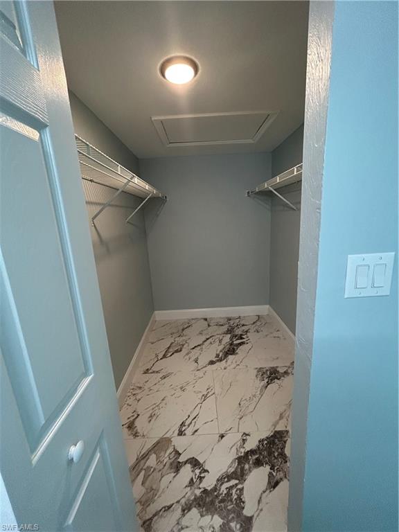 2346 Naples Trace Circle, Unit 1107 Naples, FL 34109 - Photo 7 of 17 Walk-in Closet in Main bedroom