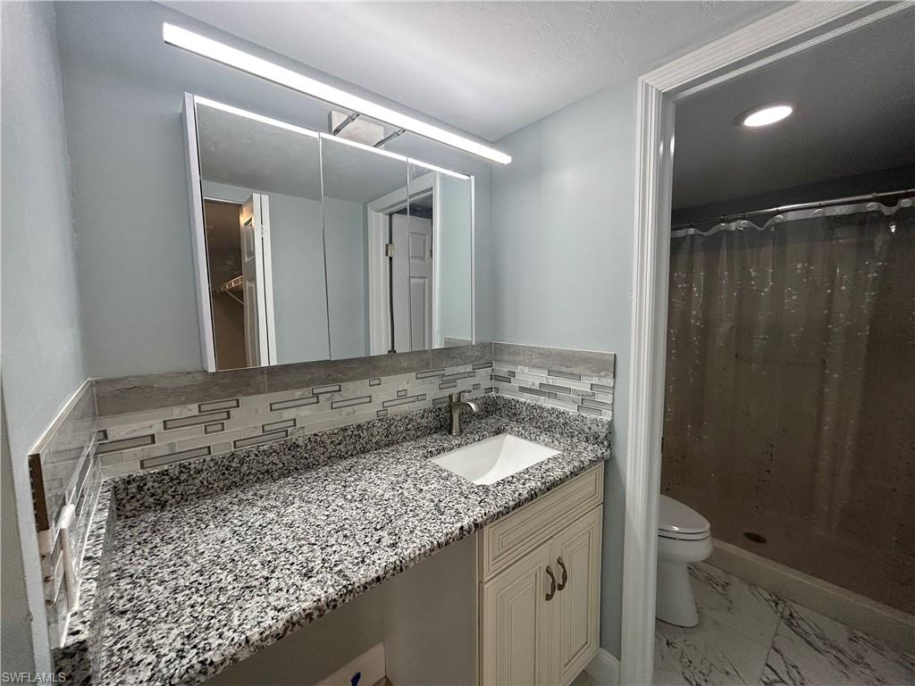 2346 Naples Trace Circle, Unit 1107 Naples, FL 34109 - Photo 8 of 17 Main bathroom vanity area