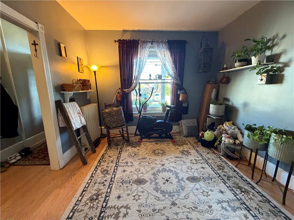 27 South Chestnut Street Boyertown, PA 19512 - Photo 12 of 17 Blonde hardwood floors extend into a sun-drenched room, highlighting the window with natural light.