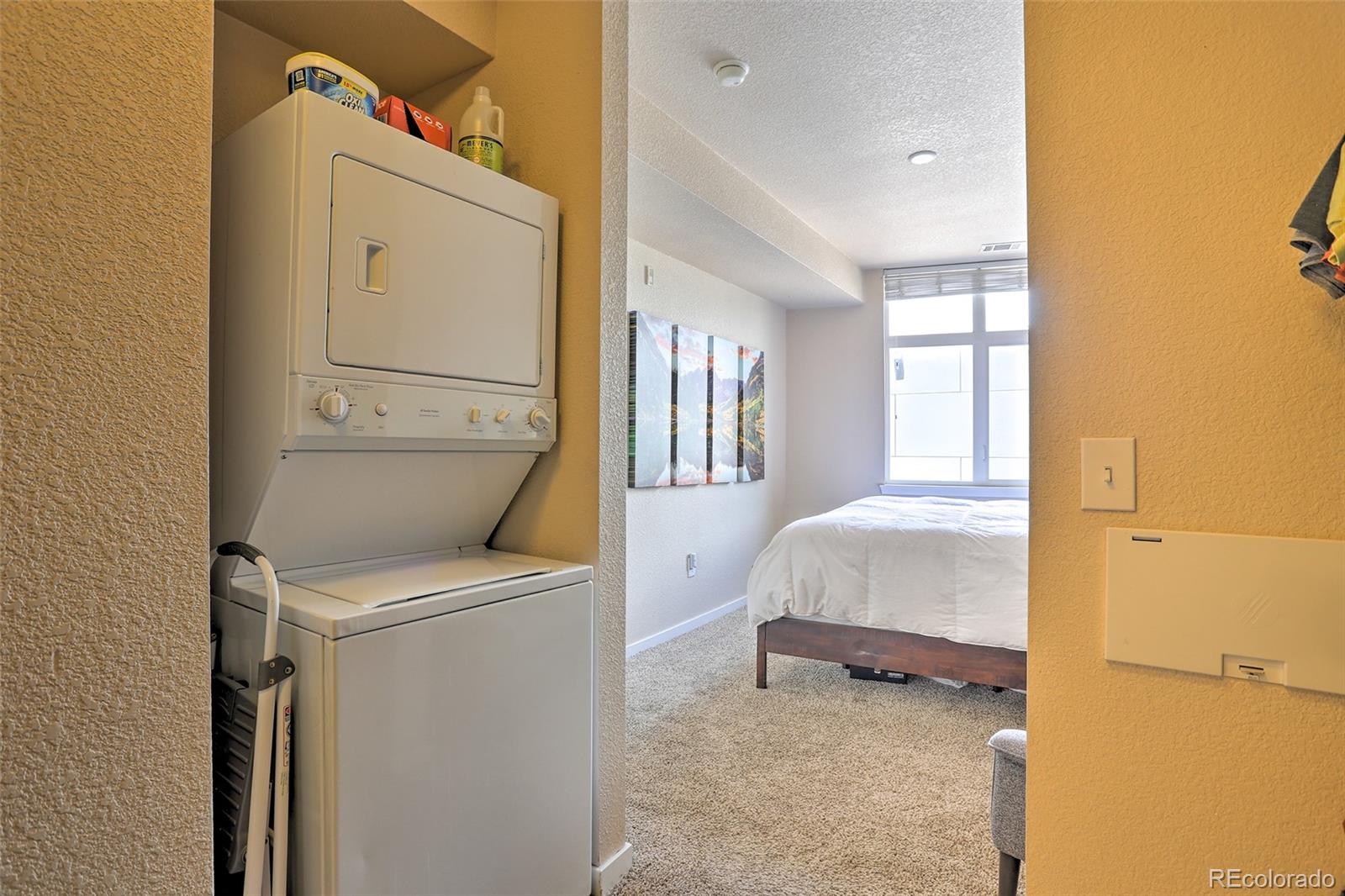 3101 Blake Street, Unit 214 Denver, CO 80205 - Photo 15 of 25 a room with a bed and a window