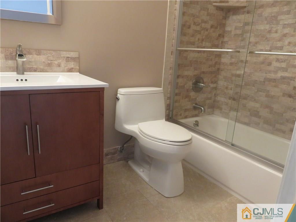 55 Primrose Circle Princeton, NJ 08540 - Photo 11 of 24 a bathroom with a sink a toilet and shower